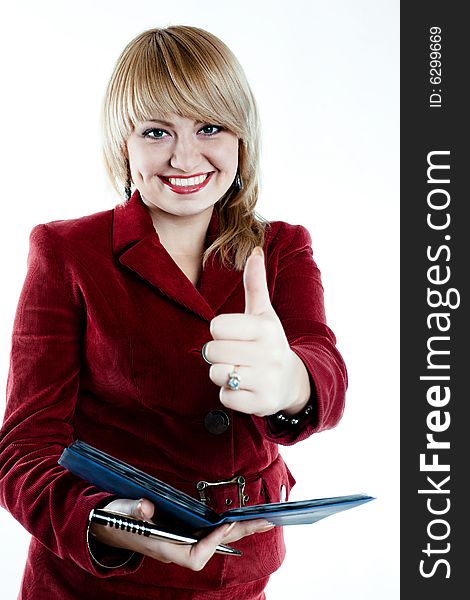 Joyful businesswoman with notebook in the hands