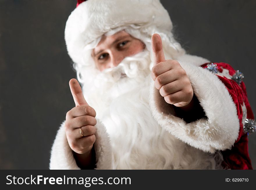 Santa Claus is preparing to celebrate Christmas. Showing tumb