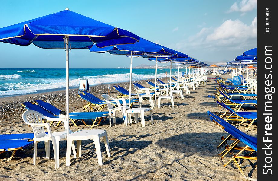 Sunbeds and umbrella on the beach. Sunbeds and umbrella on the beach