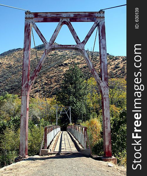 An old suspension bridge which crosses the Kern River, Ca.