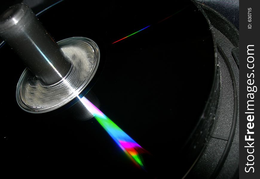 Close up of a cd stack with a rainbow shine. Close up of a cd stack with a rainbow shine