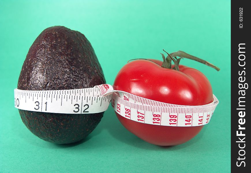 High resolution digital photo of an avocado, a tomato and a measuring tape symbolize healthy diet, cancer/disease prevention and body weight control. It is a “PRESCRIPTIONS FOR HEALTH”!. High resolution digital photo of an avocado, a tomato and a measuring tape symbolize healthy diet, cancer/disease prevention and body weight control. It is a “PRESCRIPTIONS FOR HEALTH”!