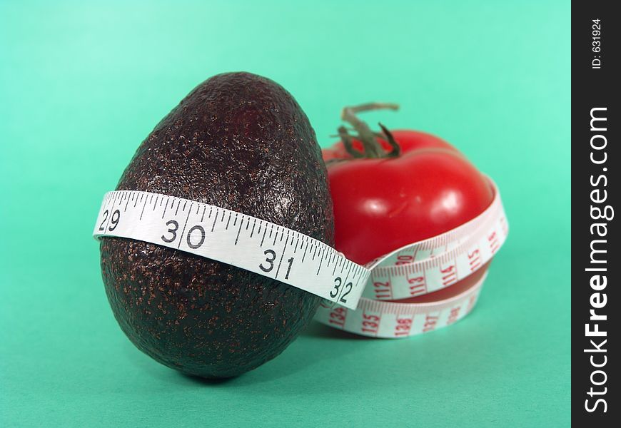 High resolution digital photo of an avocado, a tomato and a measuring tape symbolize healthy diet, cancer/disease prevention and body weight control. It is a “PRESCRIPTIONS FOR HEALTH”!. High resolution digital photo of an avocado, a tomato and a measuring tape symbolize healthy diet, cancer/disease prevention and body weight control. It is a “PRESCRIPTIONS FOR HEALTH”!