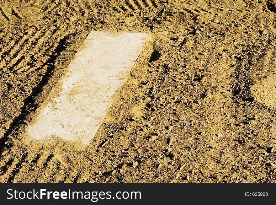 The pitcher's plate or rubber on a baseball field. The pitcher's plate or rubber on a baseball field