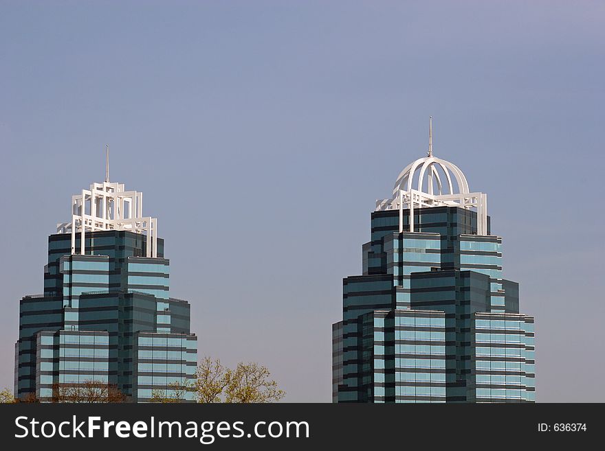 Twin office towers against sky. Room for ad copy. Twin office towers against sky. Room for ad copy