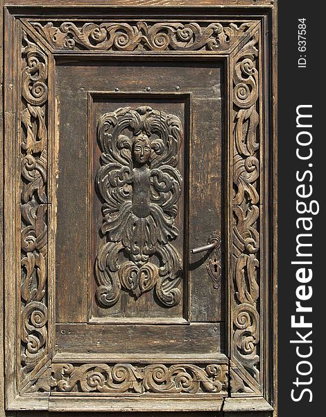 Beautiful wood decoration on an ancient door. Beautiful wood decoration on an ancient door