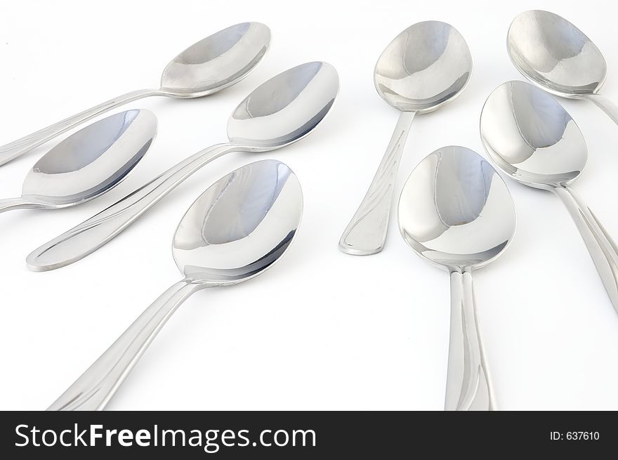 Spoons from front, over white background. Spoons from front, over white background