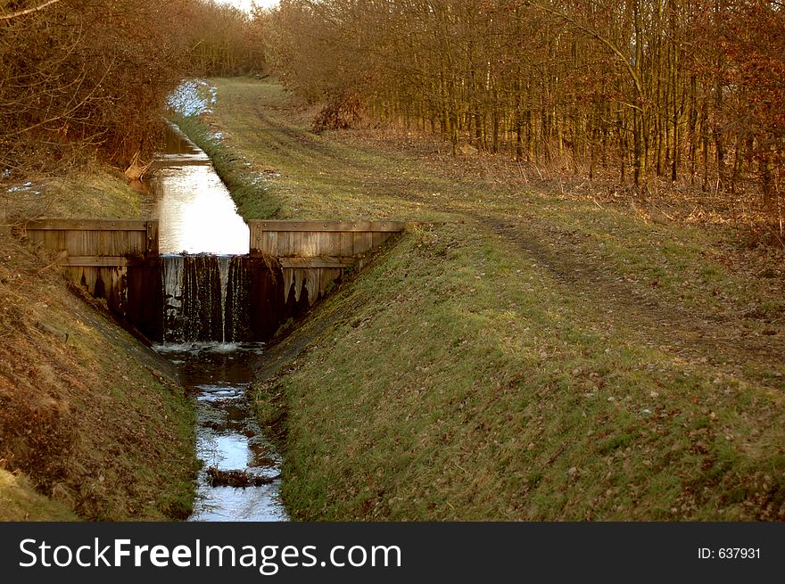 Small river with waterfall