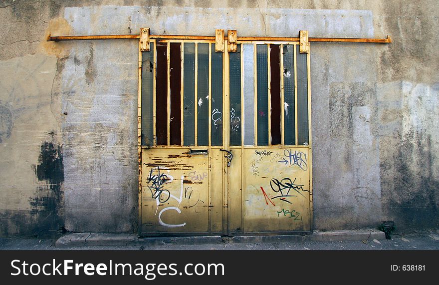 An old locked door on a building in marseille, france