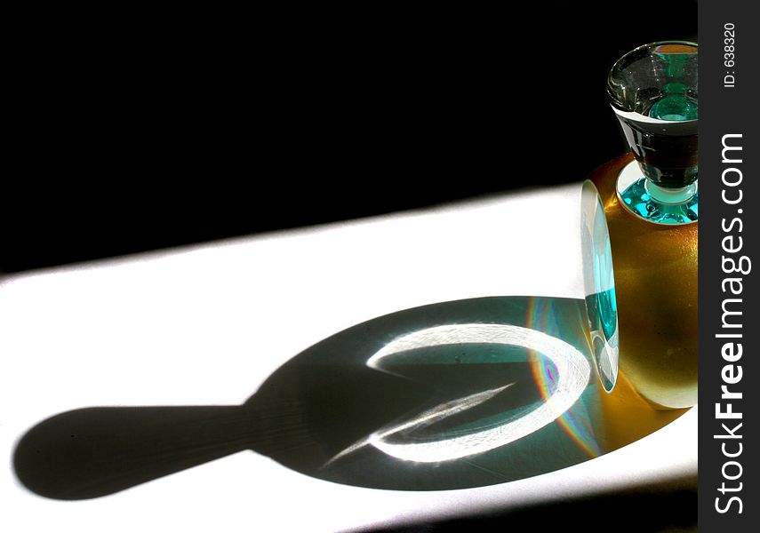 Shadow cast by a collector's perfume bottle