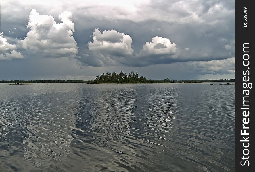 Water landscape with clouds and island
