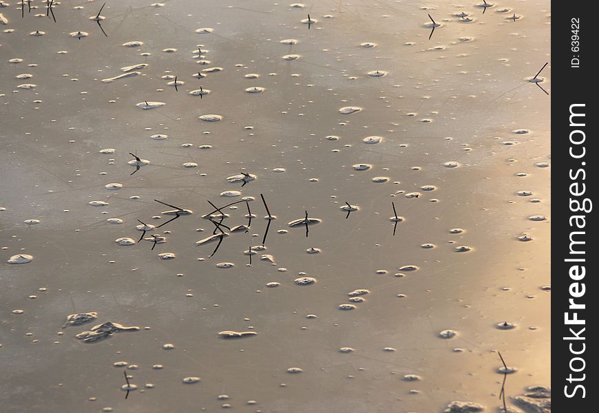 Sunset reflected in a frozen lake