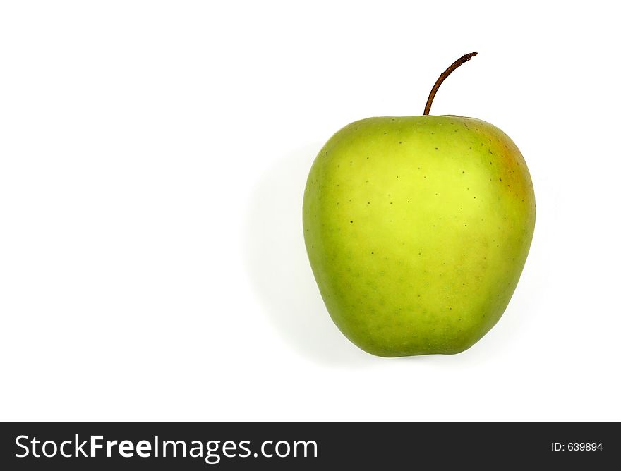 Golden Delicious apple against a white background. Golden Delicious apple against a white background.