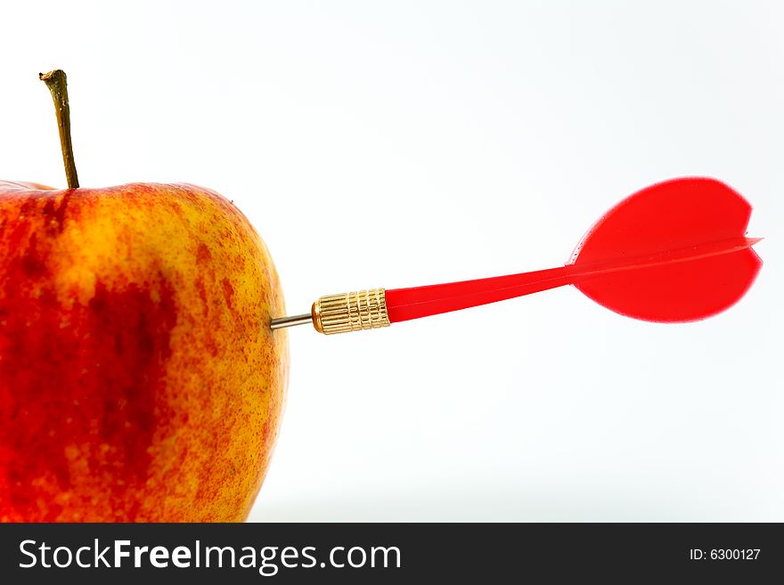 Red Apple with red Dart on White Background. Red Apple with red Dart on White Background