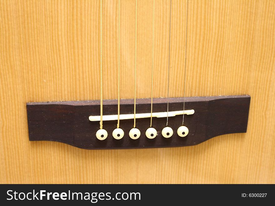 A background for music page with a wooden guitar. A background for music page with a wooden guitar