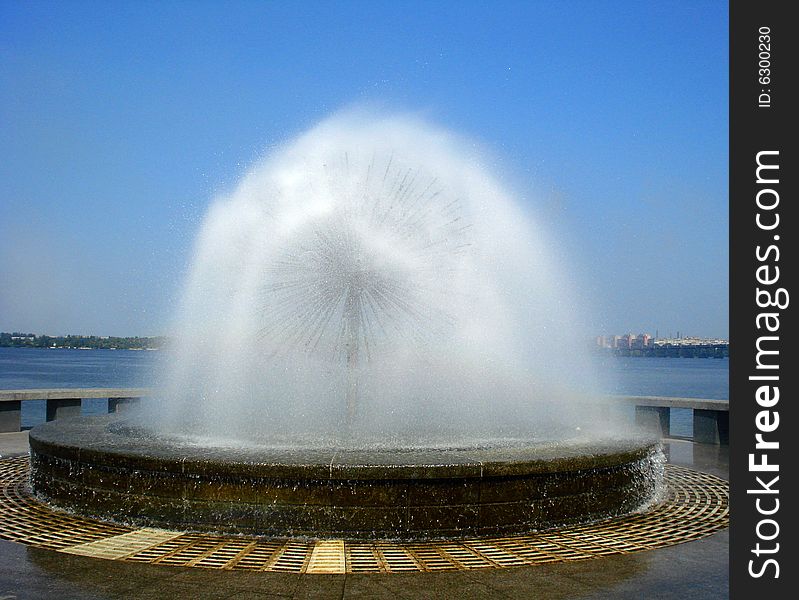 Fresh fountain in sunny summer day