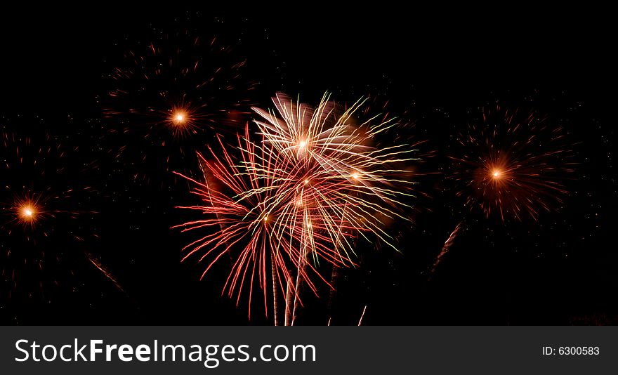 Bright colored fireworks on black background