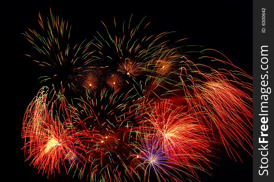 Bright colored fireworks on black background