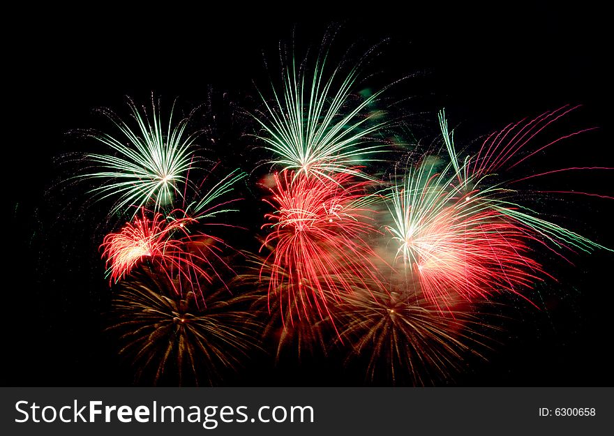 Bright colored fireworks on black background