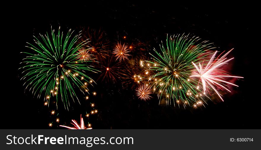 Bright colored fireworks on black background