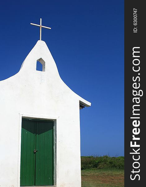 A small church on the hill on the Island of Fernando de Noronha called Capela de Sao Pedro dos Pescadores.