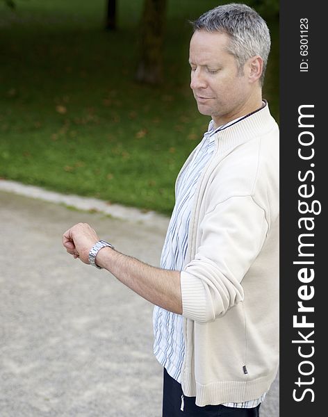 Young Man Lookng At Watch  1