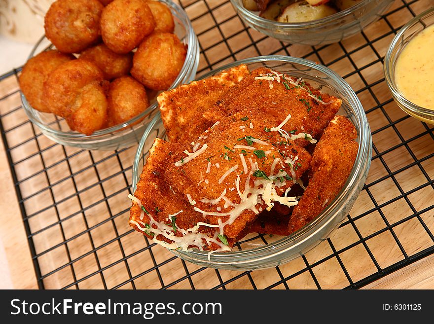 Stuffed mushrooms, fried ravioli, oven baked potatoes, marinara, honey mustard, ranch dressing. Stuffed mushrooms, fried ravioli, oven baked potatoes, marinara, honey mustard, ranch dressing.