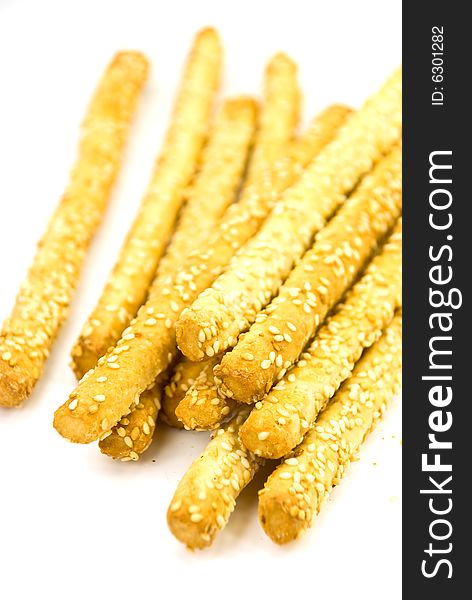 Many Breadsticks With Sesame - Isolated On The Whi