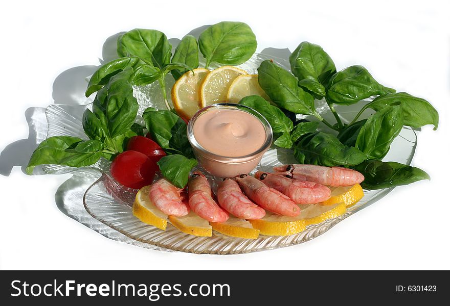 Pink sauce and shrimps on a white background
