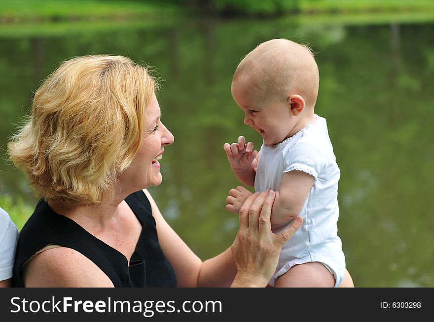 Mother and daughter playing outdoors at the park