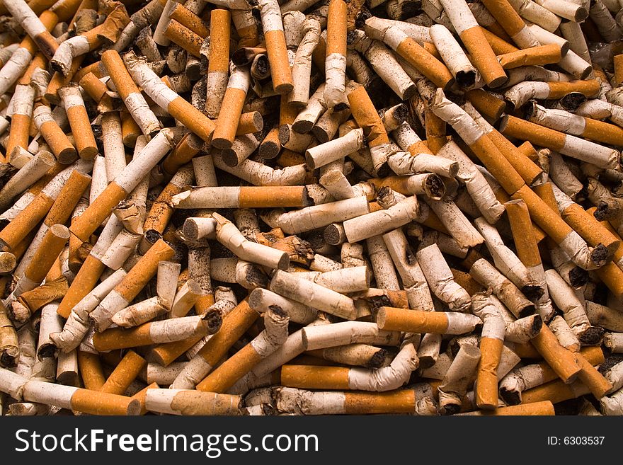 Large amount of cigarette-ends of different cigarettes