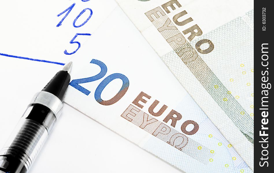 Financial calculations with euros - economics background - close up. Financial calculations with euros - economics background - close up