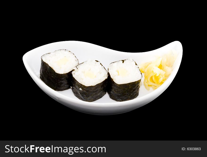 A white plate with a piece of sushi
