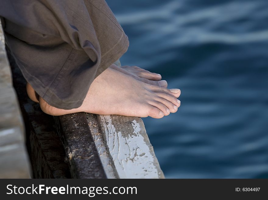 Woman's Feet on the Jetty
