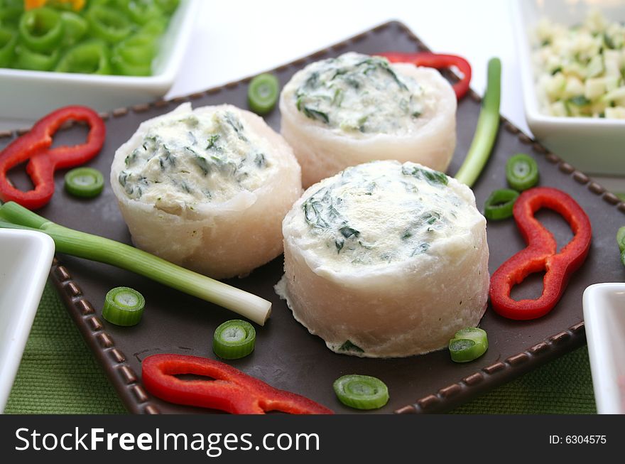 3 rolls of pangasius filet filled with spinach. 3 rolls of pangasius filet filled with spinach