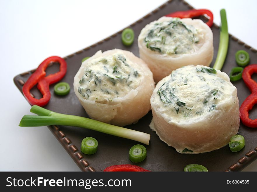 3 rolls of pangasius filet filled with spinach. 3 rolls of pangasius filet filled with spinach