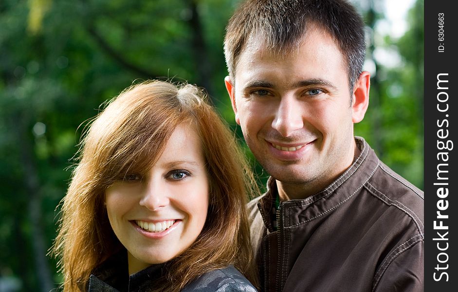 Young beautiful couple in the park. Young beautiful couple in the park.