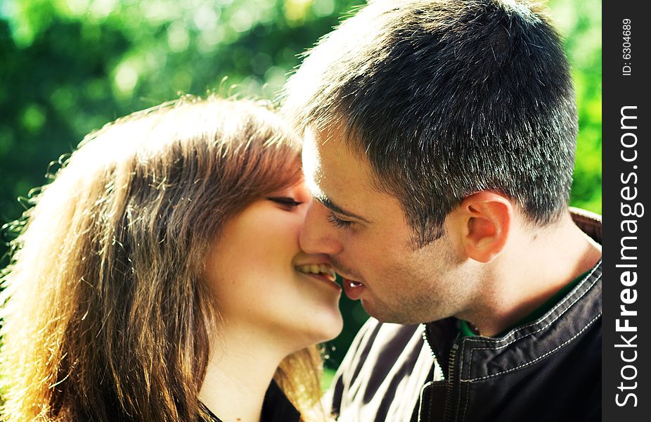 Young beautiful couple in the park. Young beautiful couple in the park.