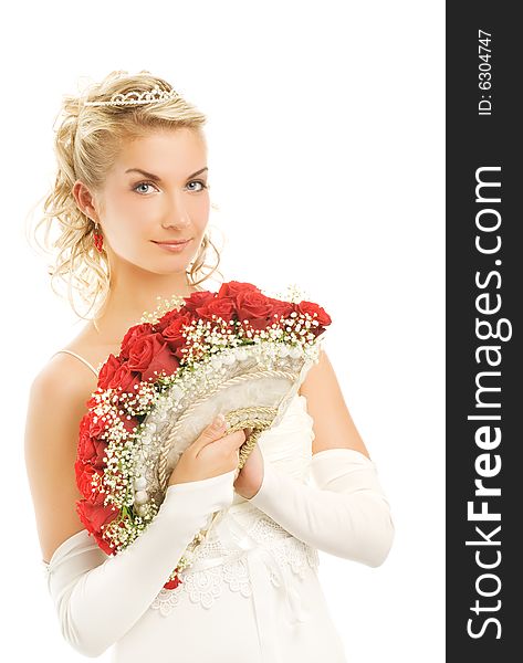 Beautiful young bride with luxury bouquet of red roses. Isolated on white background