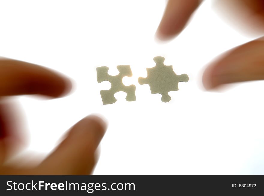 Hands And Puzzle Pieces