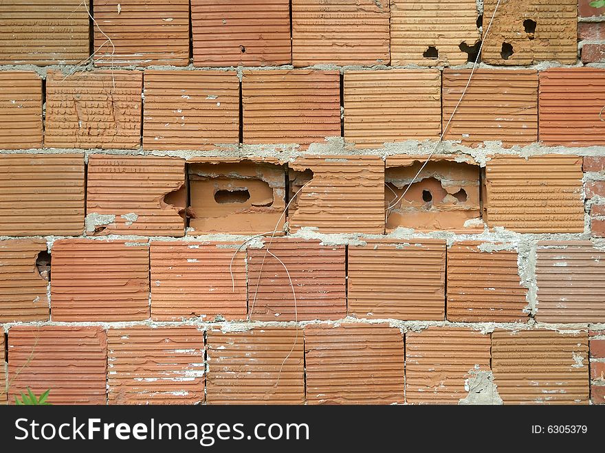 Large red brick building blocks in old wall. Large red brick building blocks in old wall