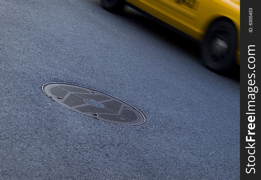A New York yellow cab running beside a culvert. A New York yellow cab running beside a culvert.