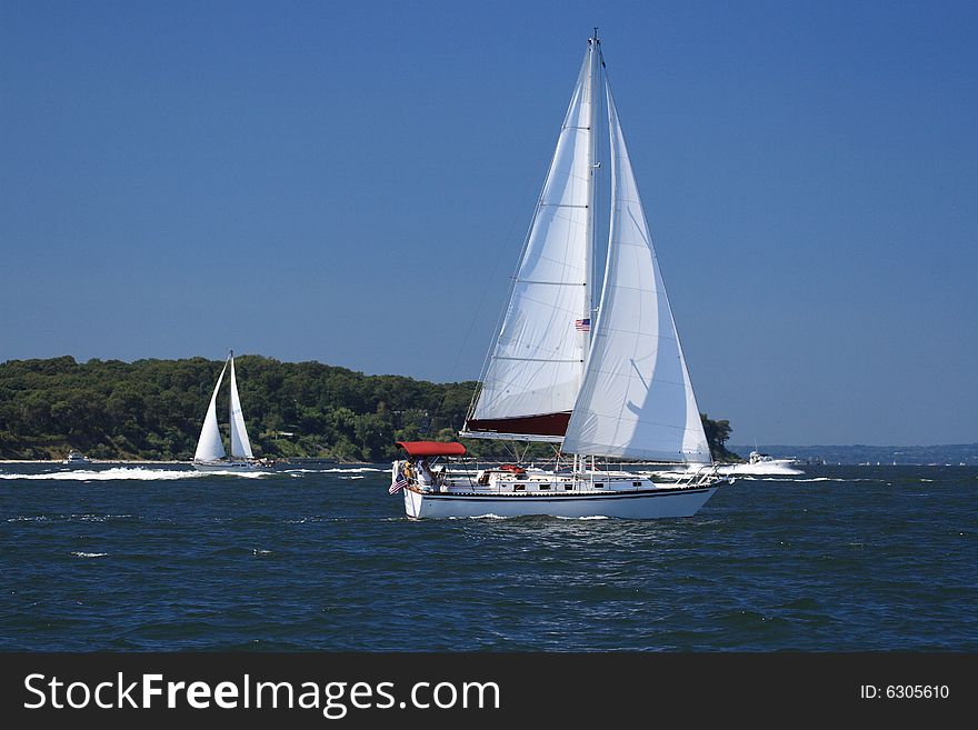 Sailboat beating into the wind on a windy day. Sailboat beating into the wind on a windy day.