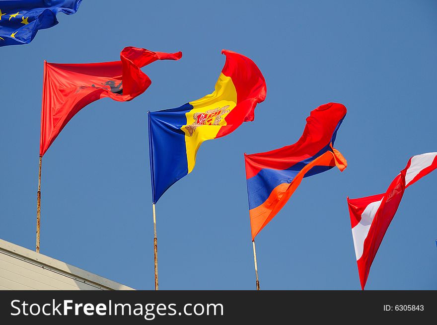 Various national flags flapping in the wind