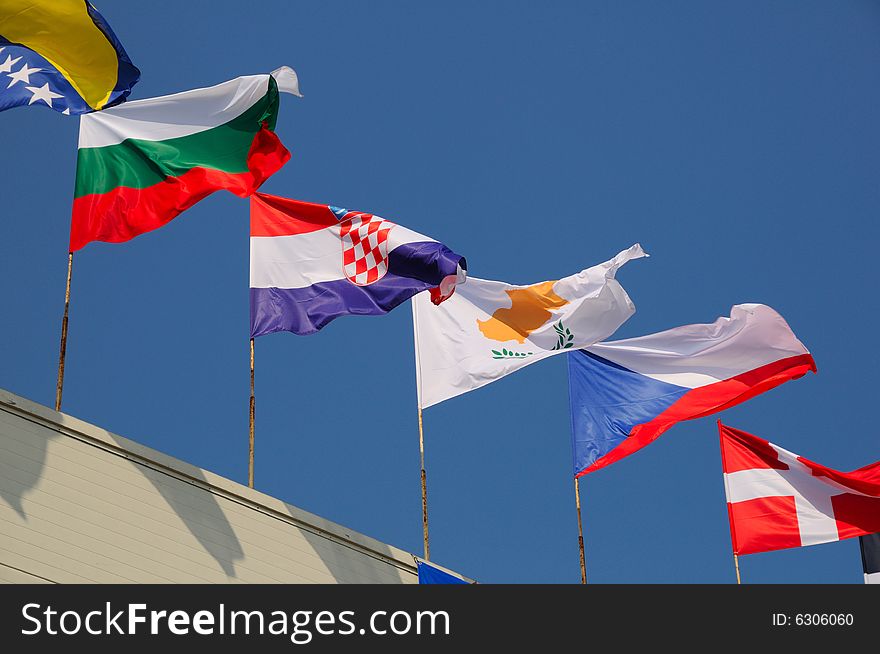 Various national flags flapping in the wind