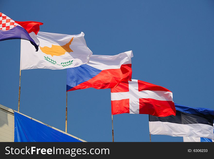 Various national flags flapping in the wind