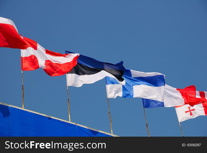 Various national flags flapping in the wind