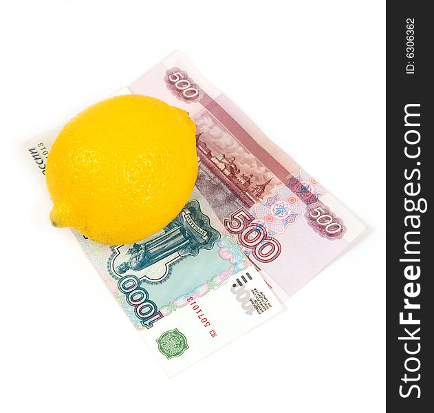 Tickets of bank of Russia with a yellow lemon on a white background. Tickets of bank of Russia with a yellow lemon on a white background