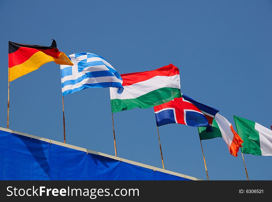 Various national flags flapping in the wind