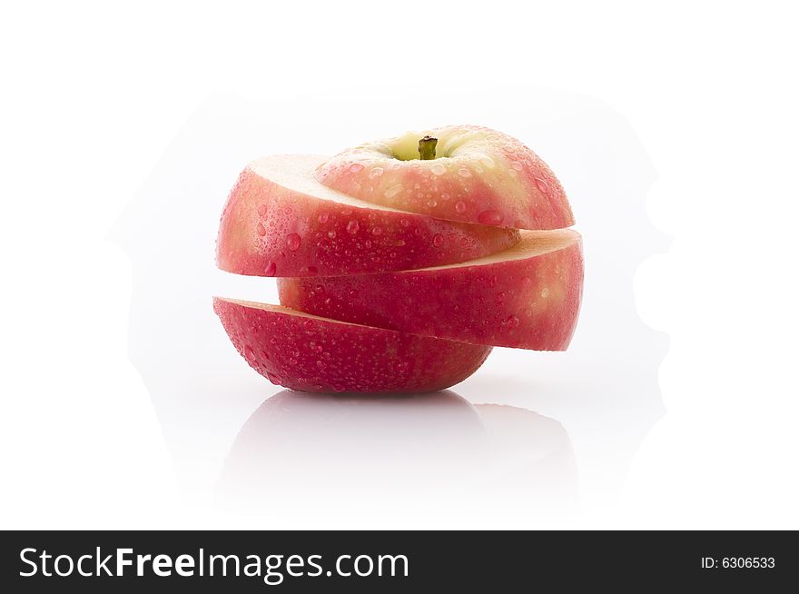 Large juicy red apple sliced with clipping path isolated on white. Large juicy red apple sliced with clipping path isolated on white